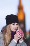 Attractive Young Stylish Blonde Girl Drinks Hot Drink From A Mug Stock Photo