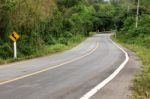 Road Curve To Mountain Stock Photo