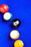 Billiard Balls In A Blue Pool Table Stock Photo