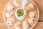 Squid Grilled Ball On Wooden Plate Stock Photo