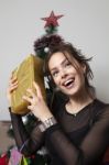 Woman Holding A Christmas Gift Box Stock Photo