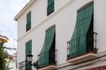 Marbella, Andalucia/spain - July 6 : Green Blinds Over Balconies Stock Photo