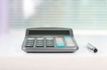 Calculator On A White Table Stock Photo