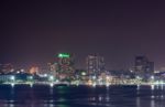 Building Skyline At Night Lights Stock Photo