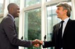 Businessmen Shaking Hands Stock Photo