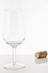 Empty Red Wine Glass And Wine Bottle Cork Stock Photo