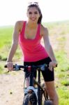 Fit Woman Riding Mountain Bike Stock Photo