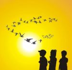 Children And Flying Geese Stock Photo