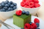 Green Tea Matcha Mousse Cake With Berries Stock Photo