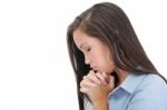 A Young Woman Praying With Her Hands Together On White Backgroun Stock Photo