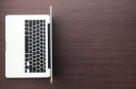 Laptop Computer With Blank Space On Wood Desk Top View Stock Photo