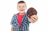 Young Boy Holding Chocolate Cookie Stock Photo