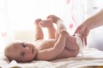 Momy Cleaning Baby Skin With Wet Wipes Stock Photo