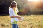 Beautiful Young Woman Enjoying Summer In A Field Stock Photo