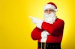 Kris Kringle Gesturing Towards The Copy Space Area Stock Photo