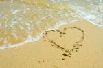 Heart In The Sand On The Beach Stock Photo