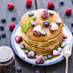 Pancakes With Honey And Berries Stock Photo