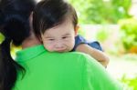 Mother Carrying And Comfort Her Daughter Stock Photo