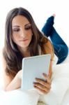 Young Woman At Home With Digital Tablet. Isolated On White Stock Photo