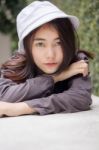 Thai Adult Girl White Cap Gray T-shirt Beautiful Girl Relax And Smile Stock Photo