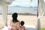 Mom With Child In Beach Stock Photo