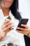 Young Pretty Business Woman With Mobile Phone In Her Office Stock Photo