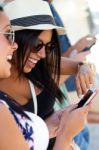 Portrait Of Group Of Friends Having Fun With Smartphones Stock Photo