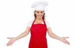 Lady chef showing welcome gesture Stock Photo