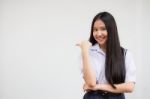 Portrait Of Thai High School Student Uniform Beautiful Girl Pointing Stock Photo