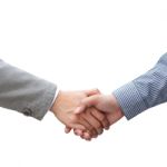 Businessmen Shaking Hands Stock Photo