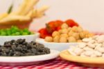 Variety Of Kitchen Ingredients With Fresh And Dried Legumes Stock Photo