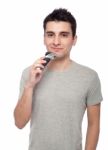 Young Man Shaving Stock Photo