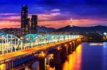 View Of Downtown Cityscape At Dongjak Bridge And Seoul Tower Over Han River In Seoul, South Korea Stock Photo