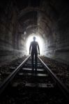 Man In A Tunnel Looking Towards The Light Stock Photo