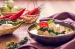 Chicken Mussaman Curry In Bowl Vegetables On Wooden Background Stock Photo