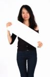 Young Girl Smiling Holding Blank Card Stock Photo