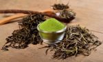 Dried Tea Leaf And Powder With Spoon On Wood Stock Photo