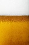 Close-up Picture Of A Beer With Foam And Bubbles Stock Photo