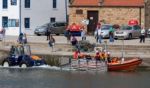 Launching The Lifeboat At Staithes Stock Photo