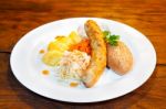 Sausages With Vegetables On A Plate Stock Photo