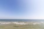 Beach With Blue Sky Background Stock Photo