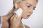 Young Woman Clean Face With Wet Wipes Stock Photo