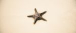 Starfish On The Beach Sand. Close Up Stock Photo