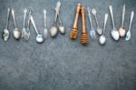 Various Cooking Utensils Border. Spoons And Fork On Dark Stone B Stock Photo