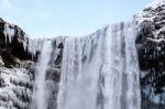 View Of Skogafoss Waterfall In Winter Stock Photo