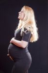 Pregnant Woman Holding Tummy Stock Photo