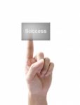 Hand Touching Success Button Stock Photo