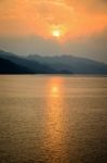 Sunset Over A Mountain At Lake Stock Photo