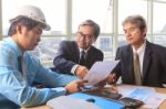 Team Of Young And Senior Engineering Man Project Meeting In Working Office For Project Discussion Stock Photo