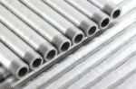 Row Of Iron Water Pipe With Strand On Line Pipe Stock Photo